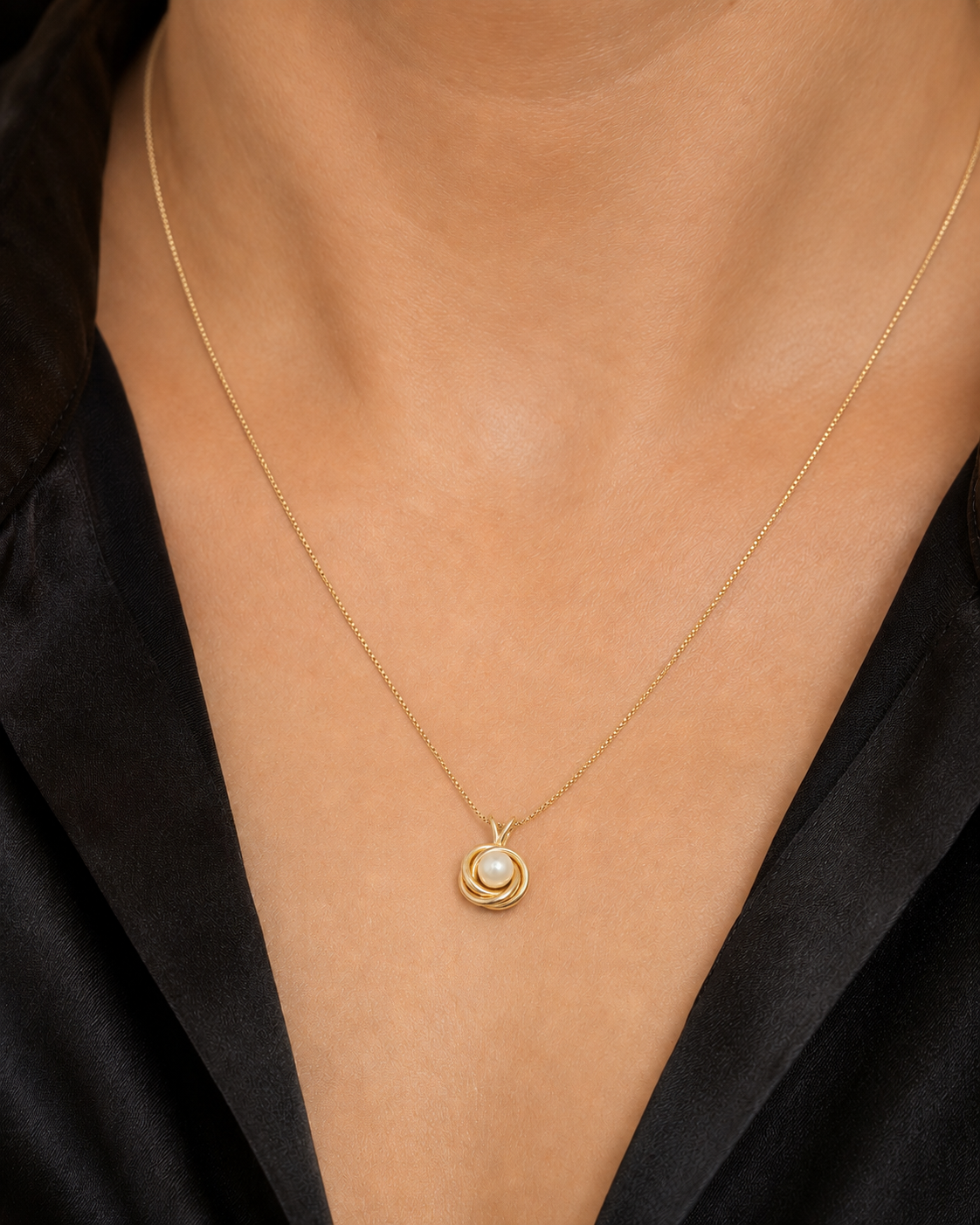 The Pearl Nest 20-inch gold necklace shown on neck for accurate scale